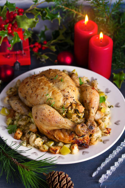 istock Roasted chicken with apple and bread stuffing. Christmas decorations. Dish for Christmas Eve. New Year food menu 1190392967