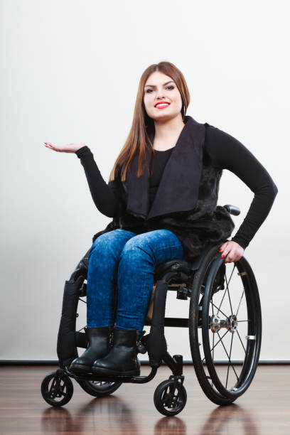 istock Disabled young girl on wheelchair. 1190393140