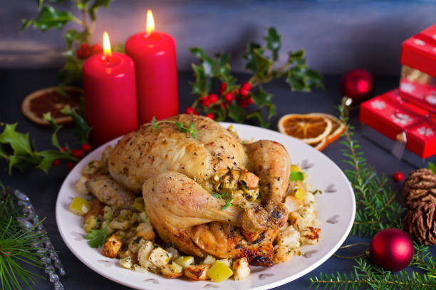 istock Roasted chicken with apple and bread stuffing. Christmas decorations. Dish for Christmas Eve. New Year food menu 1190393250