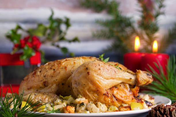 istock Roasted chicken with apple and bread stuffing. Christmas decorations. Dish for Christmas Eve. New Year food menu 1190393421