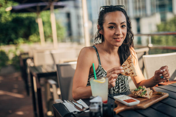 istock Woman on lunch break in restaurant 1190394882