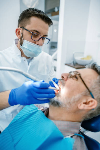 istock Mature man at the dentist 1190395067