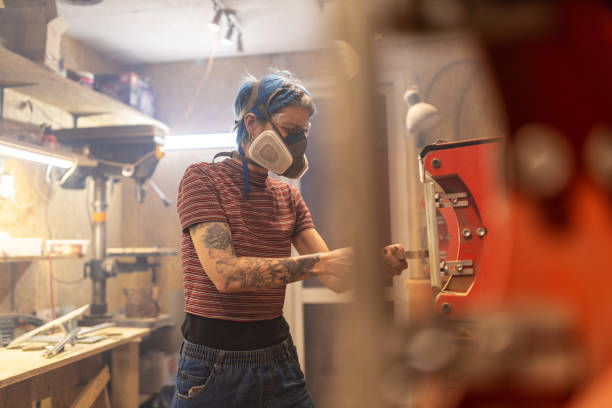 istock Young woman doing woodwork in a workshop 1190395586