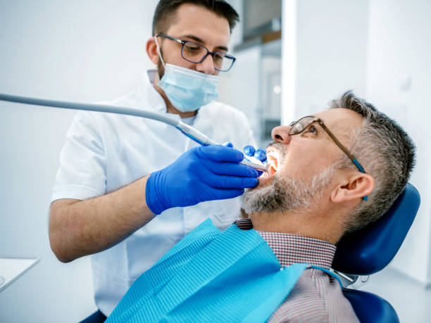 istock Mature man at the dentist 1190397815
