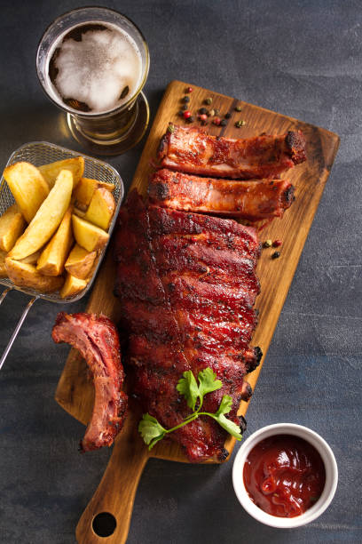 istock Pork loin ribs served on chopping board 1190400358