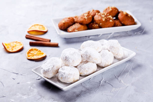 Couple Of Platters Of Homemade Greek Kourabiedes And Melomakarona stock photo