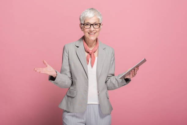 istock Senior businesswoman with a tablet 1190402026