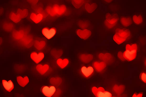 Defocused background with heart shaped bokeh stock photo