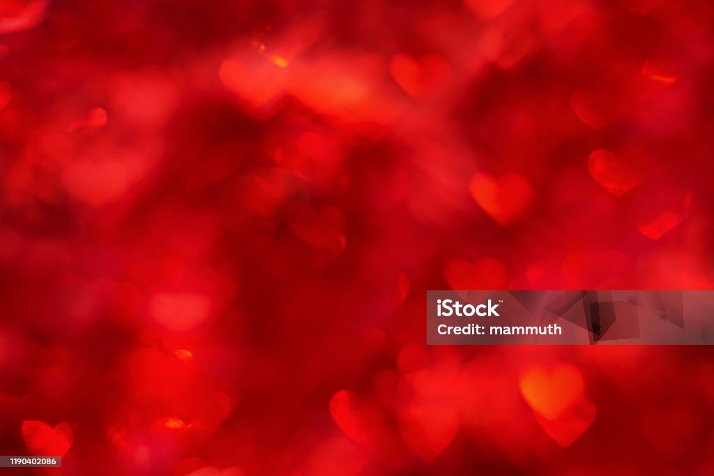 Defocused background with heart shaped bokeh Summer Bokeh Red Background Stock Photo