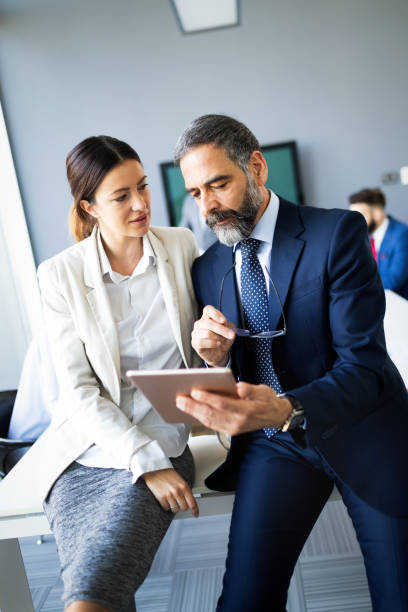 istock Collaboration and analysis by business people working in office 1190403325