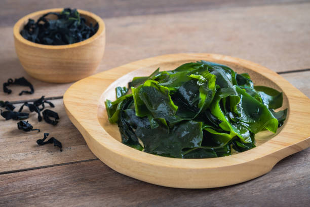 istock Wakame seaweed on wooden plate 1190403343