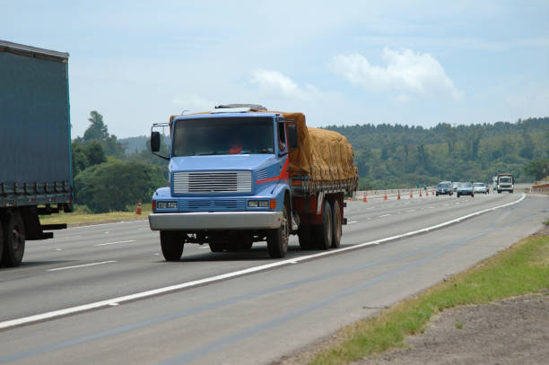 istock purple truck going downhill on major highway 1190406422