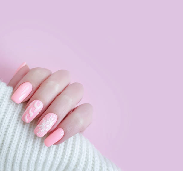 istock female hand beautiful stylish manicure sweater 1190406503