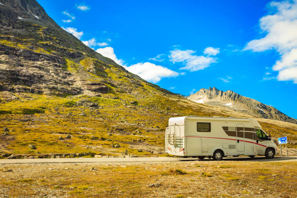 istock Camper car in mountains on roadside 1190407124