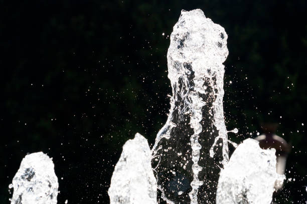 istock fountain splash water detail close up 1190408359