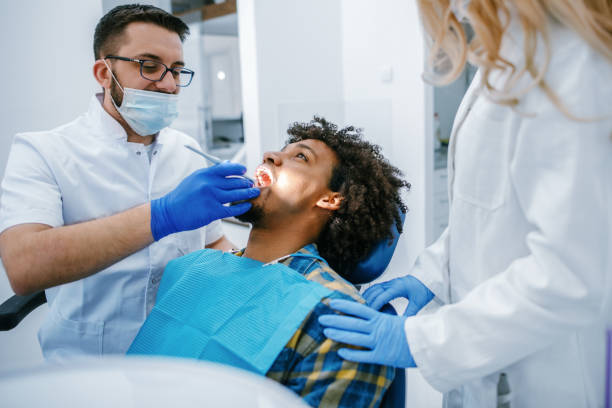 istock Patient Being Examined By Dentist 1190409470