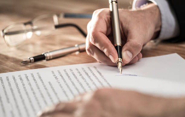 istock Business man signing contract, making a deal. 1190410399