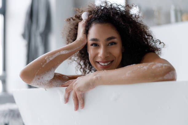 istock Beautiful Afro American lady relaxing in bath 1190411370