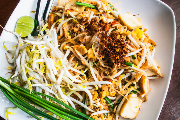 istock Pad-thai, Thai noodle in white plate, Backgrounds 1190411434