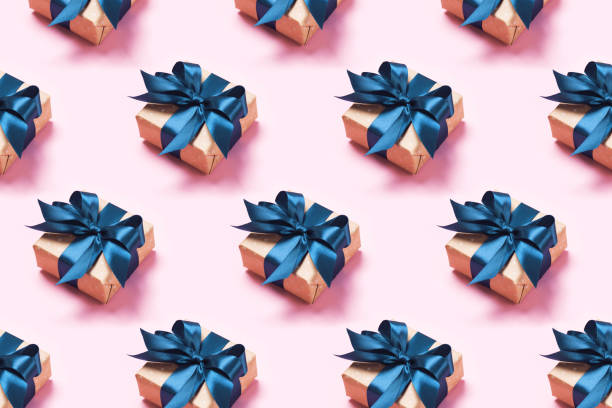istock Pattern with stylish gift on a trendy pink background 1190412383