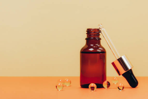 istock Face serum and vitamin capsules 1190412398