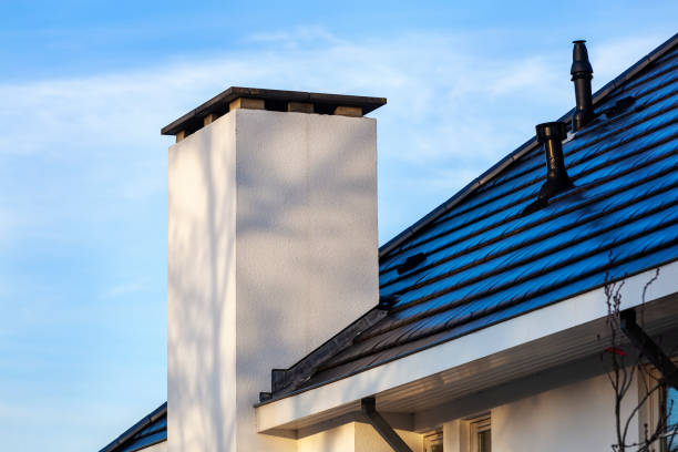 istock Contemporary white chimney and a black tiled roof 1190413562