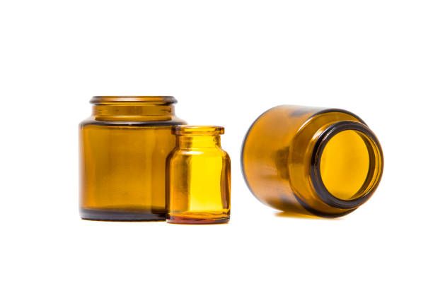 istock Small glass jars isolated on white background 1190417302