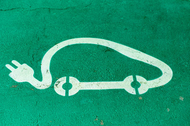 istock Car charging symbol painted on asphalt. 1190418267