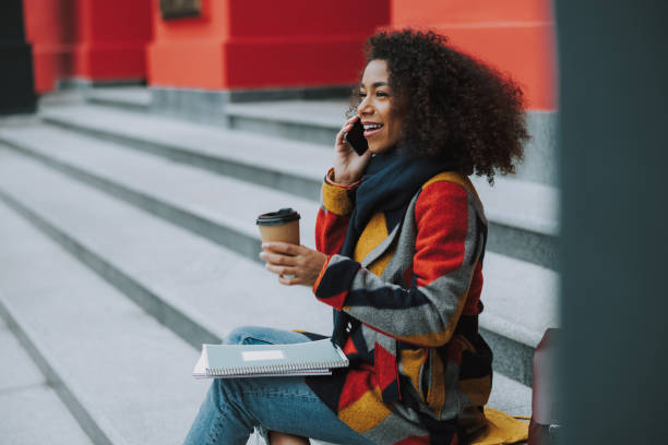 istock Afro American woman is talking on smartphone 1190418902