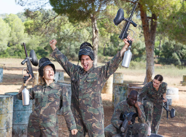 istock Satisfied paintball players won match 1190419125