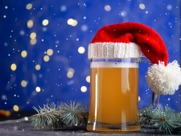 istock Christmas beer mug on blue festive background with bokeh garland 1190420593