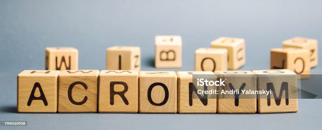 Wooden blocks with the word Acronym. Abbreviation from the initial components of a phrase or a word. Acronym Stock Photo