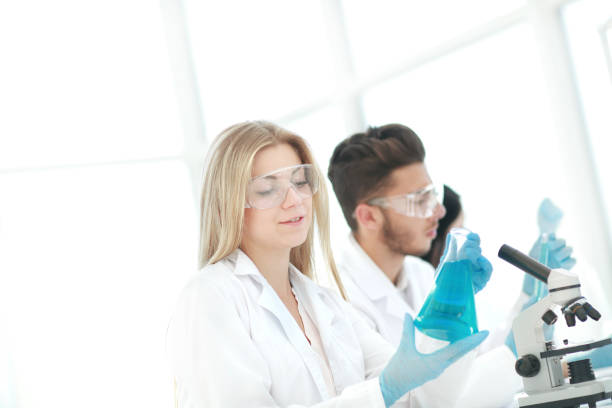 istock close up.young scientists are experimenting with liquid 1190420998