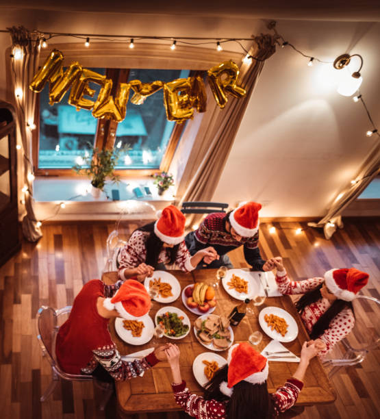istock people have fun at dinner for christmas 1190421091