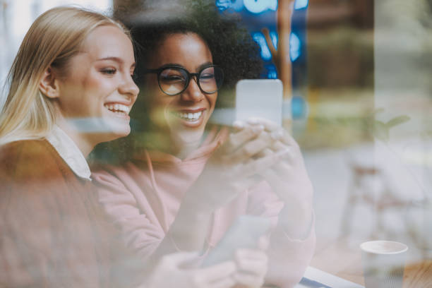 istock Two young girls are using modern smartphone 1190421863
