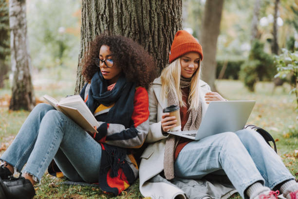 istock Two young girls spending day together in park 1190421964