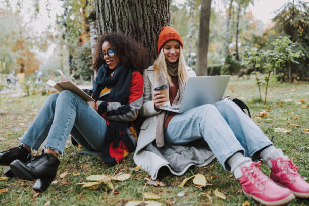 istock Two young females making homework for university 1190421978