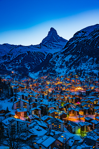 World famous Zermatt town with Matterhorn peak in Mattertal, Valais canton, Switzerland, at dusk in winter.