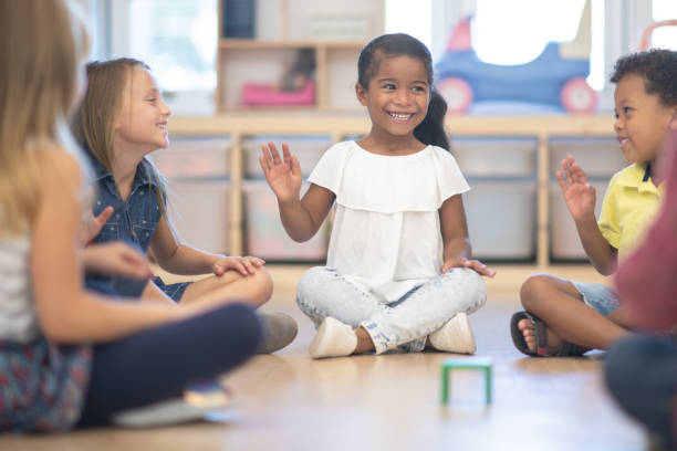 istock Kindergarten Class Singing and Clapping During Circle Time stock photo 1190424652