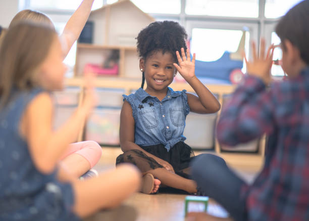 istock Kindergarten Class Asking Questions During Circle Time stock photo 1190424654