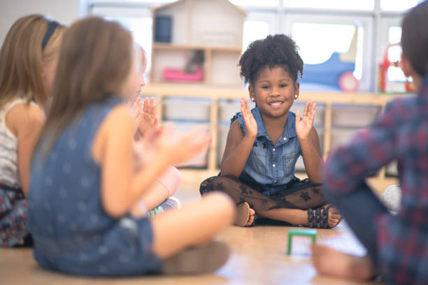 istock Kindergarten Class Singing and Clapping During Circle Time stock photo 1190424660