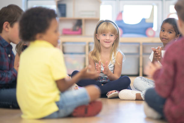 istock Kindergarten Class Singing and Clapping During Circle Time stock photo 1190424669