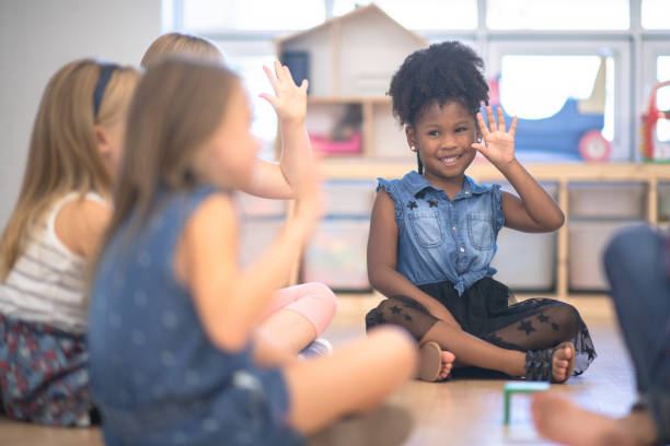 istock Kindergarten Class Asking Questions During Circle Time stock photo 1190424699