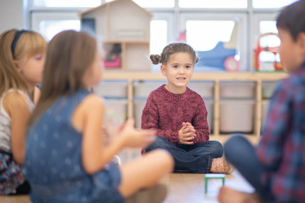 istock Kindergarten Class Singing and Clapping During Circle Time stock photo 1190425029