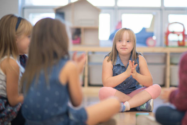 istock Kindergarten Class Singing and Clapping During Circle Time stock photo 1190425036