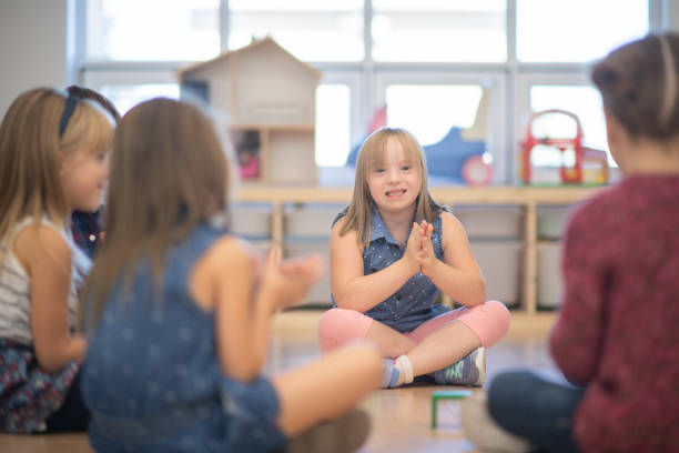 istock Kindergarten Class Singing and Clapping During Circle Time stock photo 1190425037