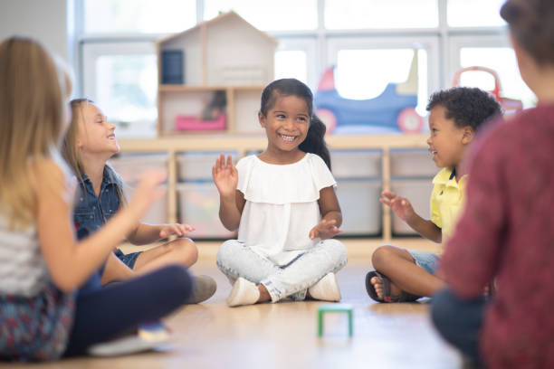 istock Kindergarten Class Singing and Clapping During Circle Time stock photo 1190425041