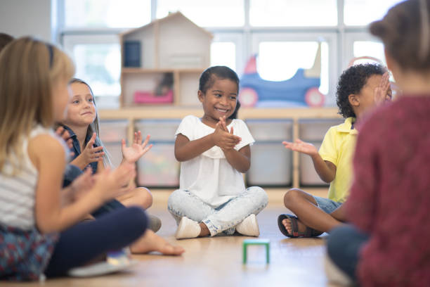 istock Kindergarten Class Singing and Clapping During Circle Time stock photo 1190425049