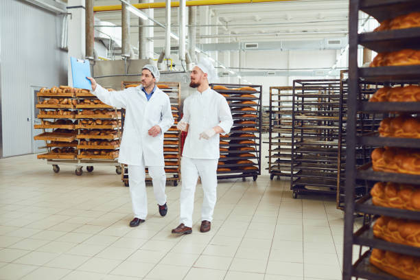 istock The technologist and baker speak in a bread factory. 1190426276