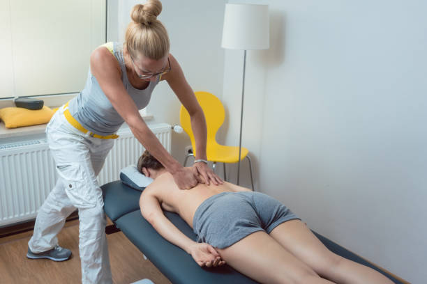 istock Pressure massage on the back during physical therapy session 1190426286